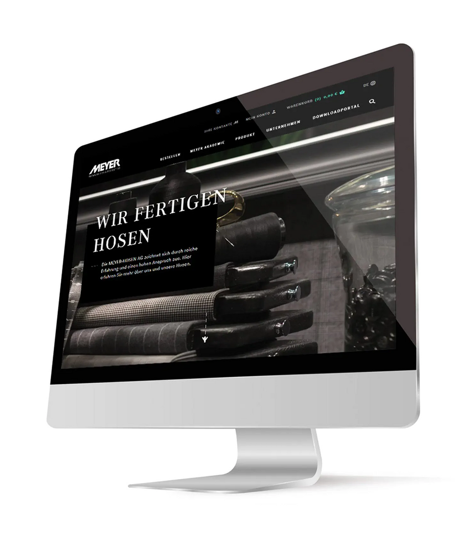 Computer monitor displaying a website with text and images on a white background